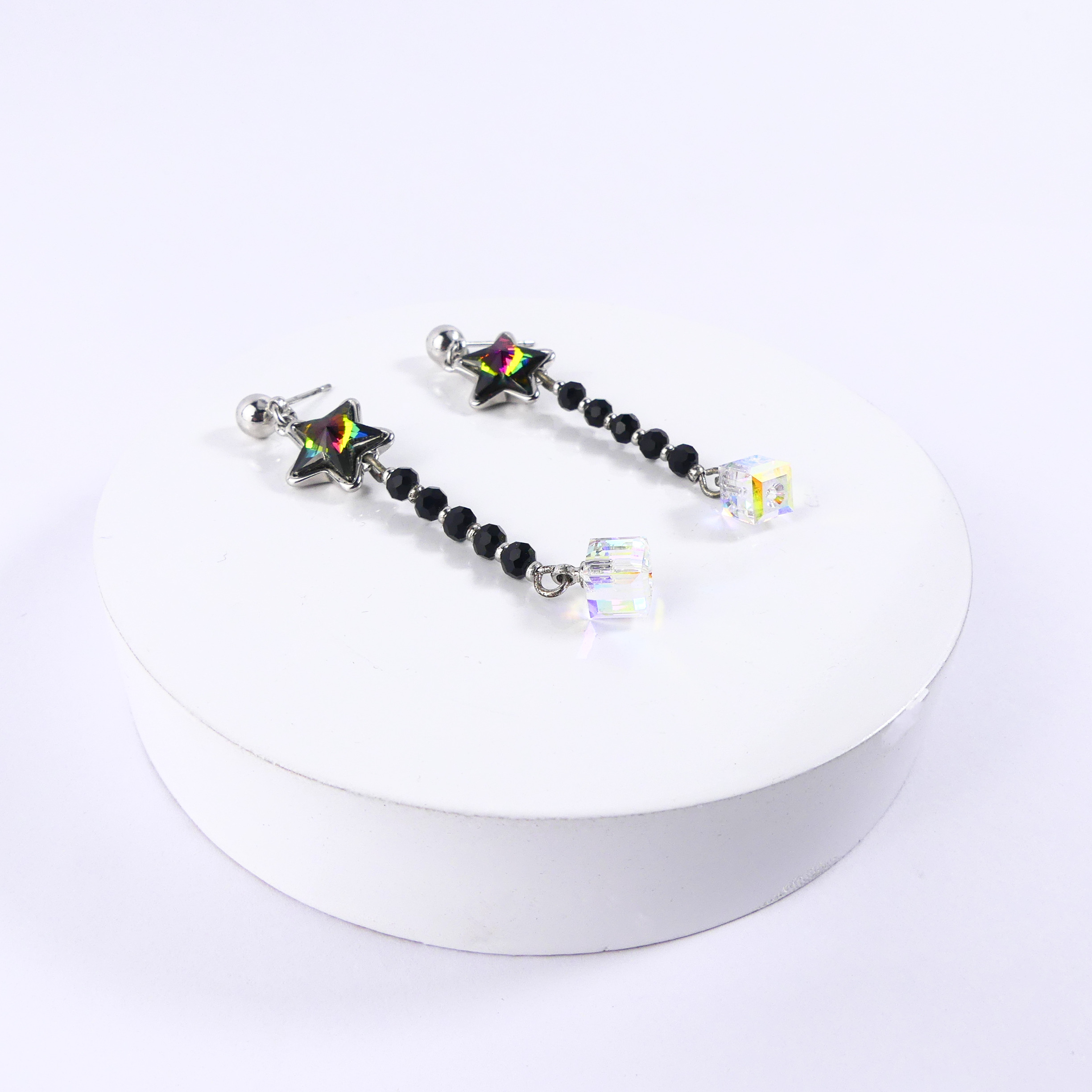 boucle d'oreille pendantes étoile verte reflet